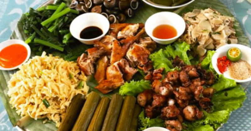 Assortment of authentic Thai dishes including grilled chicken and sticky rice in Don Village.