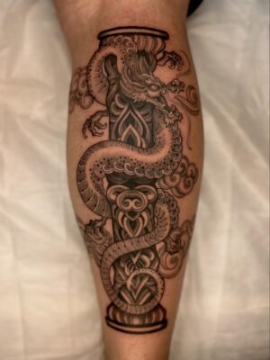 Tattoo artist working on a client in Vietnam - Vietnam Adventure