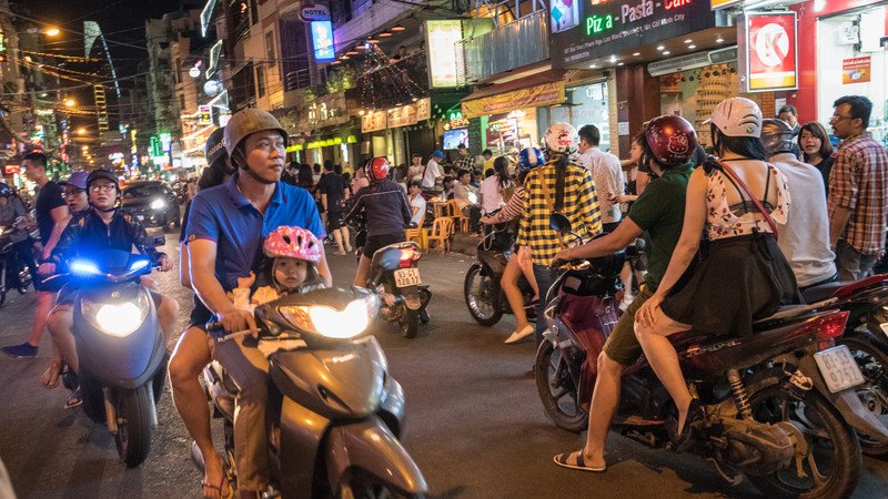 is it safe to travel to vietnam alone - street night in Ho Chi Minh City