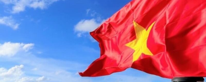Vibrant Vietnam flag showcasing red field and golden star, representing revolution and unity.